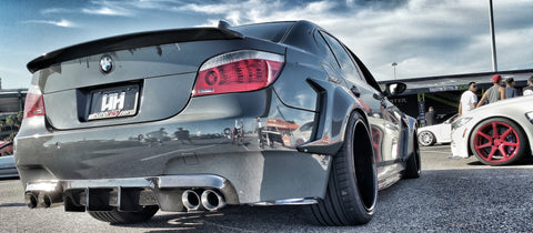 A highly customized and lowered bmw e60 with a widebody kit on Craiyon